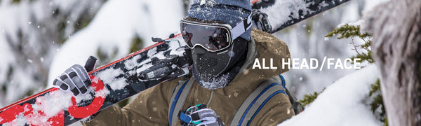 Person in face mask holding skis on snowy mountain View All Head and Face Products Category header