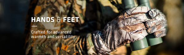 Hands & Feet Crafted for advanced warmth and versatility text on left with closeup shot of hands wearing camouflage gloves holding binoculars on right.