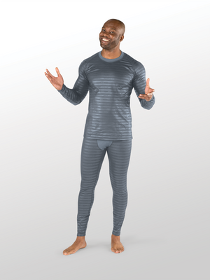 Man standing holding his arms out wearing mens grey reflective base layer top and bottoms