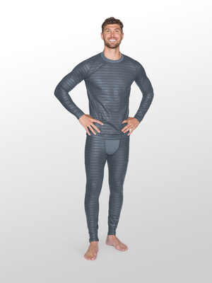 Man standing with hands on hips wearing mens grey reflective base layer top and bottom